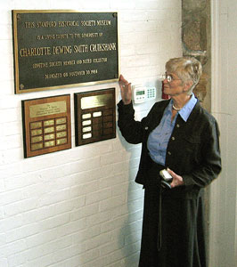 Mrs. Katherine T. S. Coley, with the plaque honoring her aunt Charlotte D.S. Cruikshank