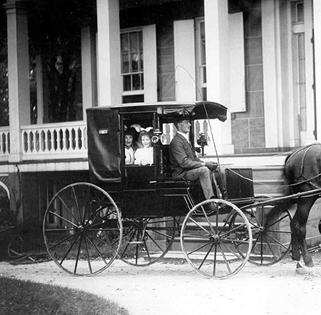 Dr. I. Franklin Wardwell and his family in their horse carriage in front of 538 Elm Street, 1900.
