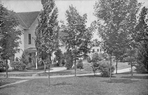 IN NEIGHBORLY COTTAGES, THE SOCIAL LIFE HAS ITS PLEASANT FEATURES