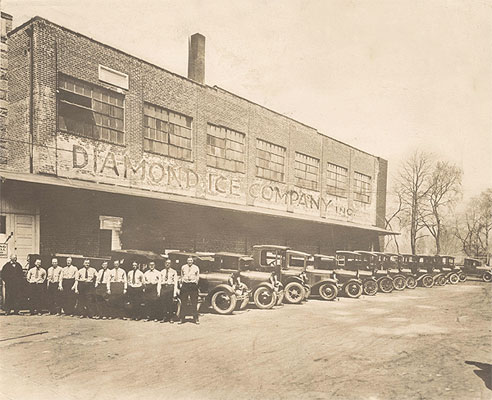 Diamond Ice Company building, employees, and delivery trucks, c. 1920