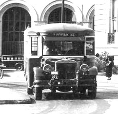 A bus. Citizens Savings Bank in the background.