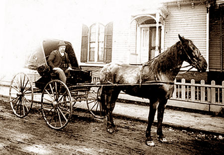 Dr. Francis Rogers in front of his home, corner of Cottage & Atlantic Streets, ca. 1900.