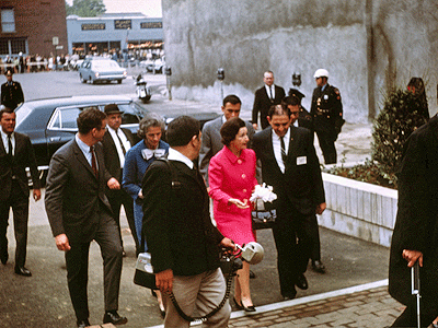 the first lady is welcomed, Mrs. Laurence Rockefeller in blue