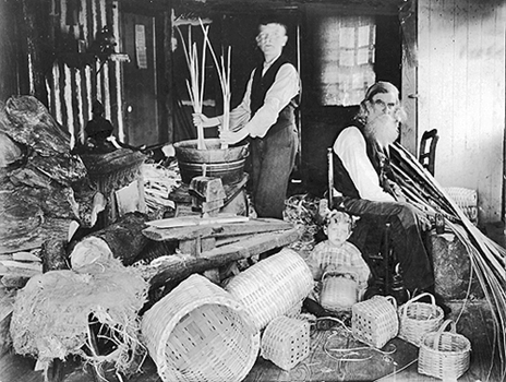 Rezo and Ernest Waters in their basket weaving shop, circa 1900